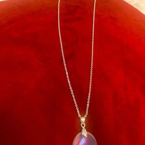 Beautiful angel aura pendant on sparkling chain.